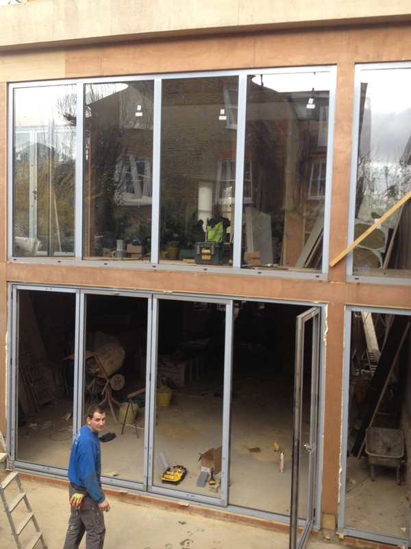 Aluminium bi-fold doors with two-storey glazing in Leytonstone