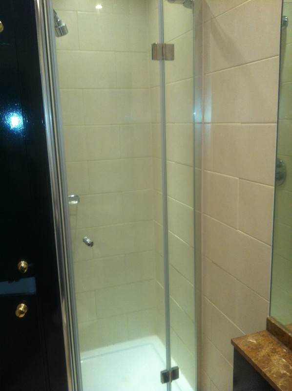 Frameless glass shower enclosure with chrome fittings in Leytonstone